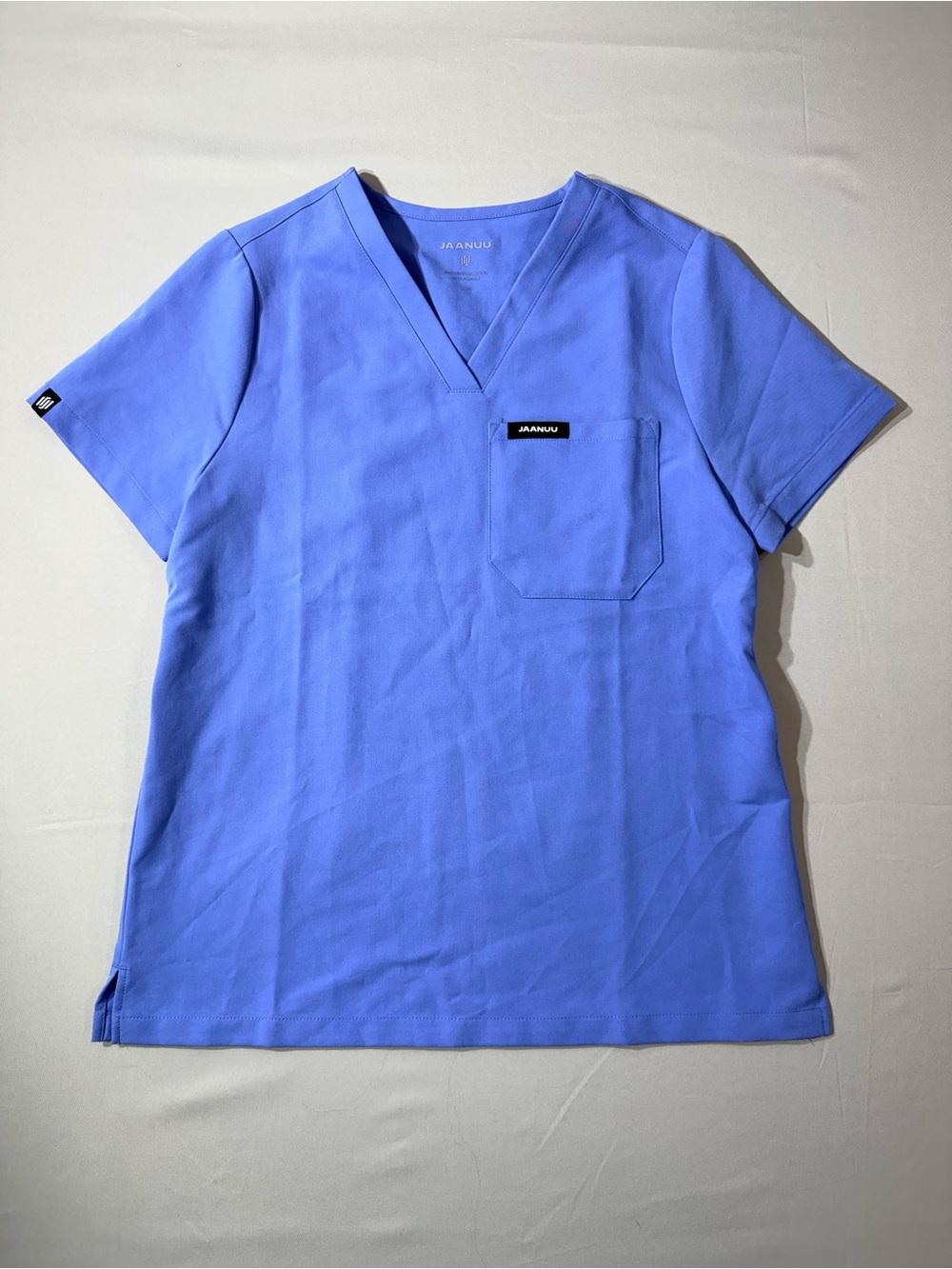 JAANUU Rena essential one pocket Scrub top in Ceil Blue